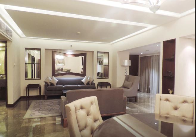 Ambassador suite in the generous space of a 100 m² suite that features a king bed, dedicated workspace at separated living room, with complimentary high-speed WIFI, marble bathroom with separate bath